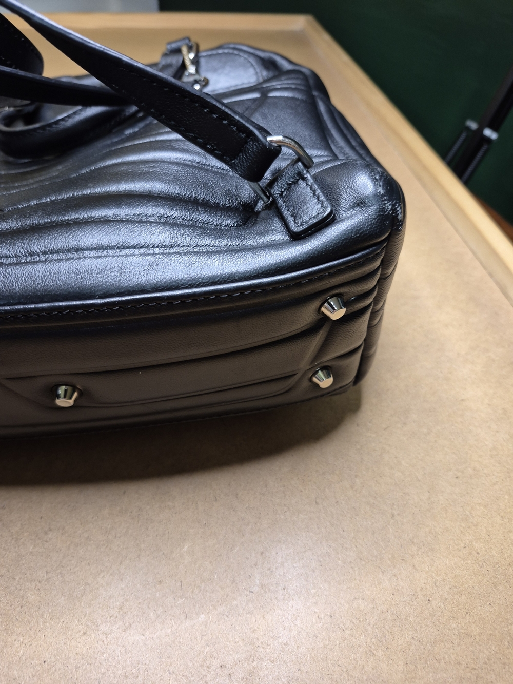 Black Quilted Leather Backpack with Polished Metal Clasp - Picture 8 of 11